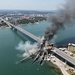 war in ukraine, 2 0 2 2, artillery strike in crimea bridge, bridge collapsing, wide angle shot, aerial photograph, hyper realistic, structural failure, catastrophic