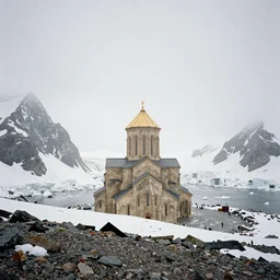 a overlook of a artic mountain. below is a large monolithic cathedral, blocking out the rest of the view of the over look. grainy, overcast sky, snowing.