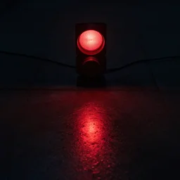 red light from above is reflected on the floor