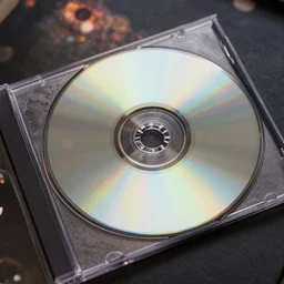birds eye view wide angle portrait of a cd case with a cd that is reflecting a lot of color off of it, detailed, award winning, 8 5 mm, bokeh,