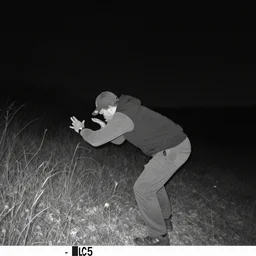 Jerma985 caught on trail camera, low quality, nighttime, black and white,