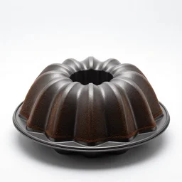 gothic bundt cake pan, studio product photography, isolated on a pure white background, centered, entire object in frame, sharp focus, soft studio lighting