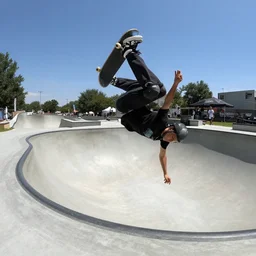 pov gopro of a skatboarder doing a backflip in a halfpipe