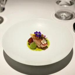 a fine dining photo of a plate of exquisite flowers, michelin star meal, restaurant
