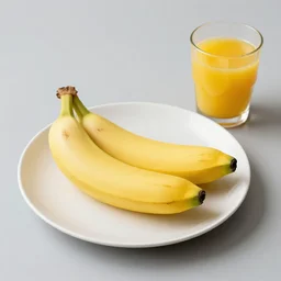 A plate that has no bananas on it. there is a glass without orange juice next to it.