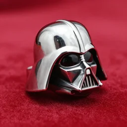 silver darth vader helmet ring, on red cloth, side view, ring photography