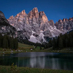 extremely beautiful alpine scenery at night with milkaway, dolomites, calm lake in foreground, intricate details