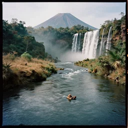 kodak portra 4 0 0 photographic and realistic, a desert and forest and volcano and waterfalls, detailed, octane render, unreal engine, 4 k, artstation, hyper realistic, wide angle, floor flooded, how a river, objects that float, 3 5 mm, sharp focus, soft light, volumetric light, in the style of gregory crewdson
