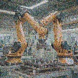 A large, robotic arm moving metal parts in a factory.
