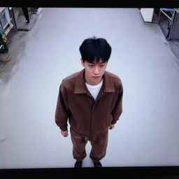 man in brown clothing, security camera footage,