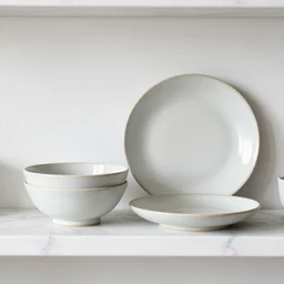 ceramic bowl and plate on a marble shelf