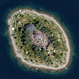 the island of bornholm seen from a satellite. people are partying