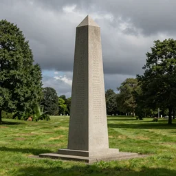 a large, granite obelisk in a grassy field in summer. overcast sky.