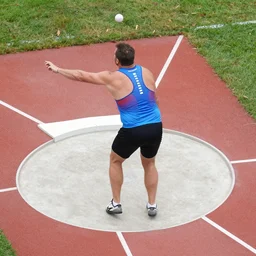 a birds eye view of geoff capes putting a shot put