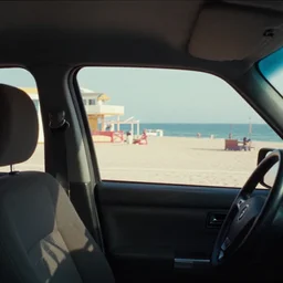 fuji 5 0 r ; 3 5 mm ronin film still of car interior with front seat side window view with ; in the background projection of beautiful hyperrealistic tilt shift wide shot style film still from ronin ( 1 9 9 0 ) beach promenade scene directed by wes anderson, highly detailed, cinematic lighting, 8 k