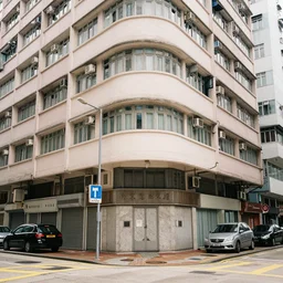 hong kong apartment viewed from the street corner, in the style of carne griffiths