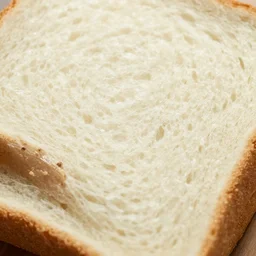 extremely detailed close up of a piece of white bread