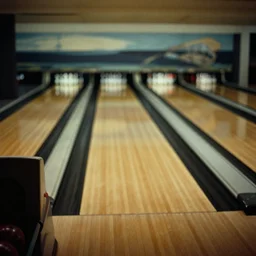 a 35mm photograph of an empty bowling alley in the 1950's, bokeh, Canon 50mm, cinematic lighting, photography, retro, film, Kodachrome
