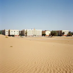 1 9 7 0 s movie still of a empty stalinist style town in the desert, cinestill 8 0 0 t 3 5 mm eastmancolor, heavy grain, high quality, high detailed
