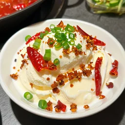 “Sichuan hot pot ice-cream topped with green onions and dried chili peppers, award winning photography”
