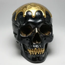 black shiny onyx human skull with molten gold dripping from top slips over