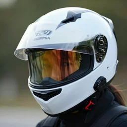 person wearing motorcycle helmet, mirrored visor