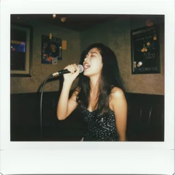 a polaroid photograph taken by nobuyoshi araki of a beautiful woman with long hair singing passionately in a karaoke bar in tokyo 1 9 7 8