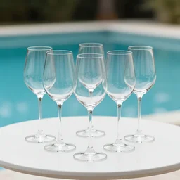 5 5 mm photo of best wine glass on a zen minimalist white table with gorgeous pool in the background. highly detailed 8 k. intricate. lifelike. soft light,