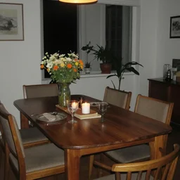 photo of a dining room taken with a cheap digital camera at night flash lighting