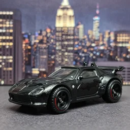 3 5 mm photo of black batman car, tim burton cinematic, dark, hot wheels model with new york city as background