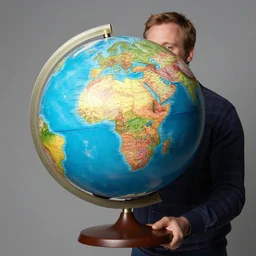 phil spencer holding a globe, photo