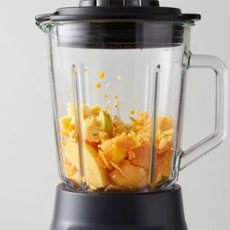 fruits inside a blender getting shredded, high speed blender, particles flying, shredded, slow motion, ultra fast shutter speed, 8 k, macro shot, canon 4 0 mm, studio light