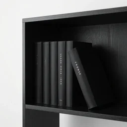 A bookshelf and crypt style photo of the colour black.