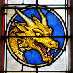 the head of a yellow dragon, tenth century stained glass window
