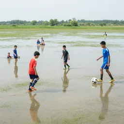 boys playing soccer on a floodplain field with family members sitting in the stands, south america's, sunny day, atmosphere, dynamic light, photorealistic, dynamic light, ultra detailed