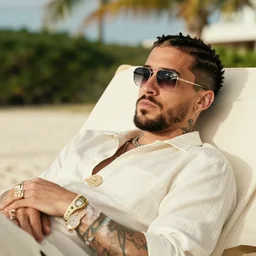 music artist bad bunny relaxing in aruba, hyper realistic, highly detailed, award winning photo