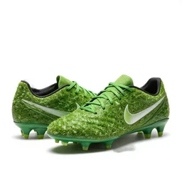 nike soccer cleats made out of grass turf, sitting on a white background