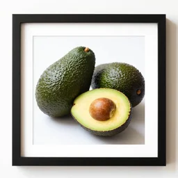 a framed photo of avocados