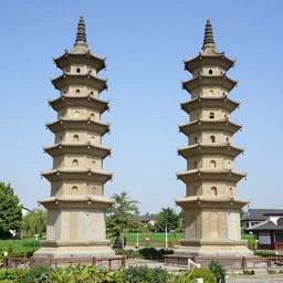 twin chinese buddhist pagodas made of stone in a beautiful chinese landscape by vincent van gogh