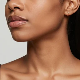 feminine looking, darker skin by one tone, attractive neck, dimples