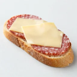 a piece of bread with salami, cheese on top