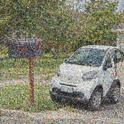 a (((((tiny))))) car next to a mailbox