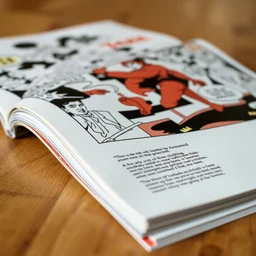 photo of a comic book on a wood table, macro