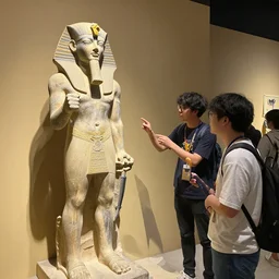archeologists discovering an ancient statue of a yugi oh duelist in egypt