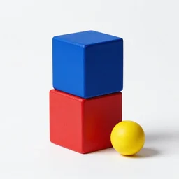 a blue cube on top of a red cube, beside a smaller yellow sphere