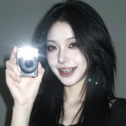 2006 photograph of a goth girl with braces, pale, black hair, camera flash on